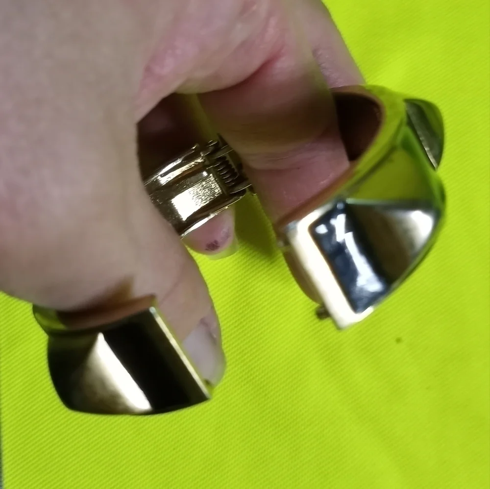 Goldtone pyramids Black hinged bracelet